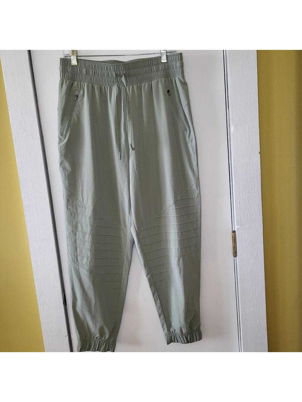 All in Motion Women's Stretch Mid-Rise Woven Moto Pants in a sage green COLOR M